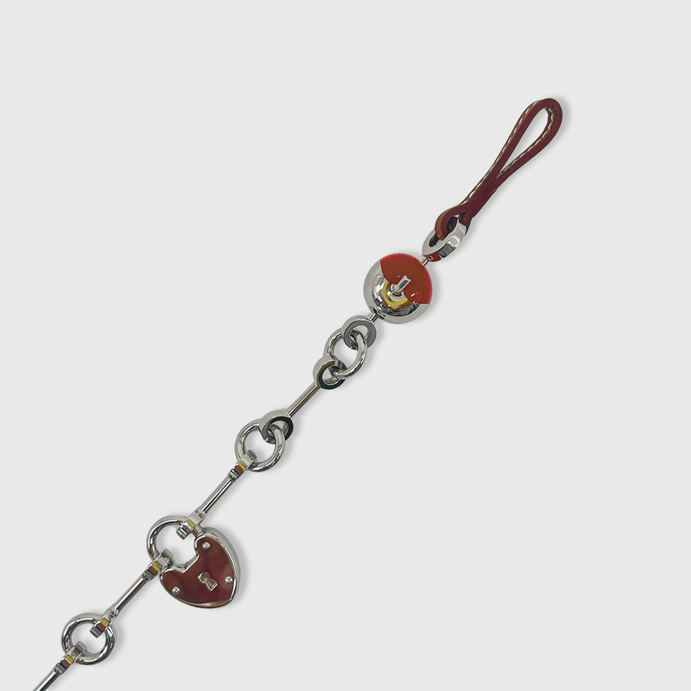 Hermès Bijou de Sac Charm Metallic, Calfskin Fauve / Rouge de Coeur