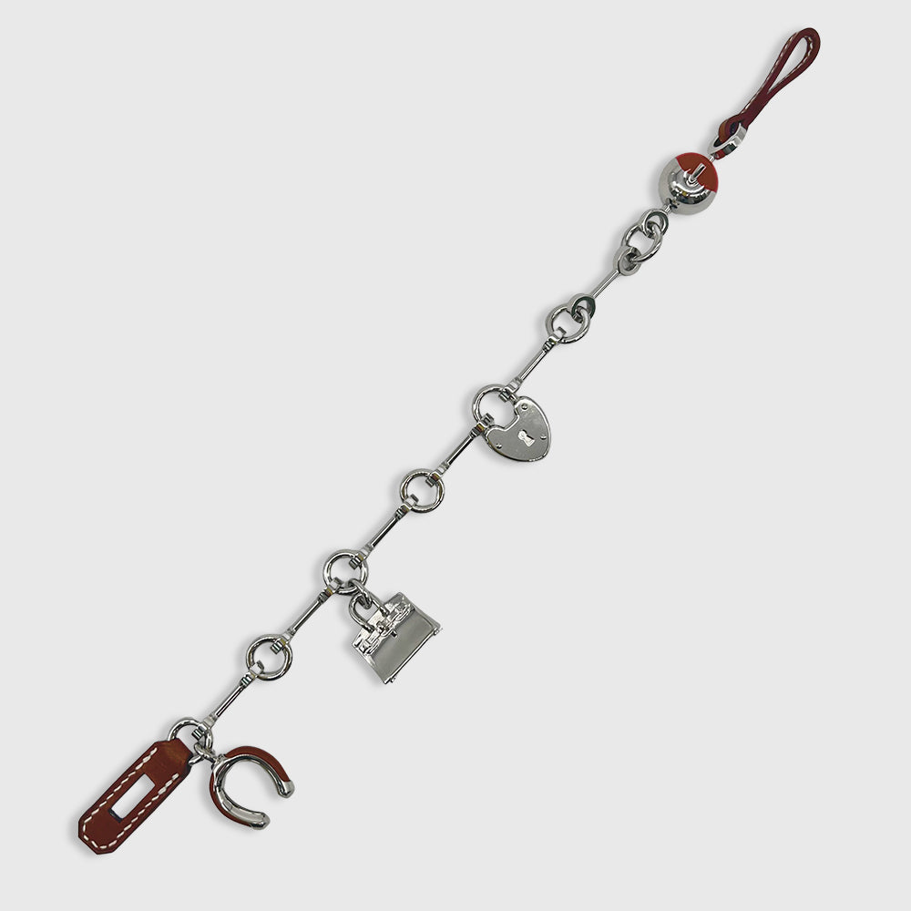 Hermès Bijou de Sac Charm Metallic, Calfskin Fauve / Rouge de Coeur